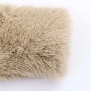 Detailed close-up showing soft beige faux fur texture and thick fiber density of the jacket