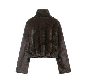 Detail view of dark brown faux fur jacket with stand collar and elastic hem texture