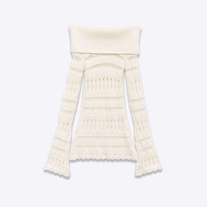 Elegant white off-the-shoulder pointelle knit sweater with delicate flared sleeves