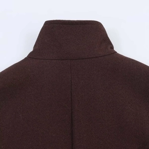 Detailed view of dark brown wool coat back collar with high neck tailoring and stitching