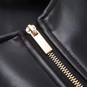 Chic black faux leather jacket with high-quality gold metal zipper and belt details