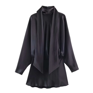Detail of black satin mini dress featuring elegant high neck and draped scarf tie accents