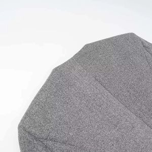 Detail showing high-quality heather grey fabric texture and durable stitching on the garment