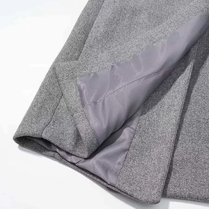 Close-up of premium gray wool fabric texture and smooth inner lining of the coat