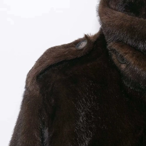 Faux fur short coat in dark brown featuring a plush texture and stylish button detail