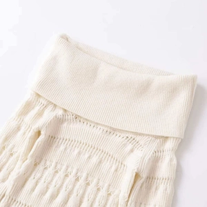 Chic cream off-shoulder knit sweater with cutout floral patterns and ribbed high neck details