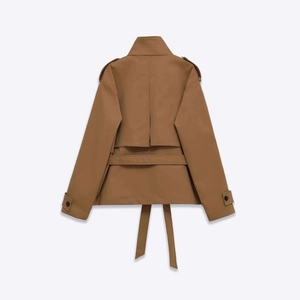 Back view of classic brown short trench coat for women with waist belt and epaulettes