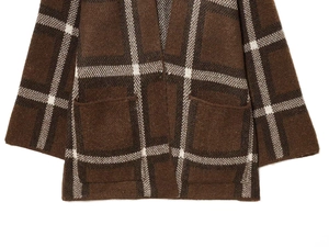 Detail shot of vintage brown plaid knit cardigan featuring large pockets and fuzzy texture