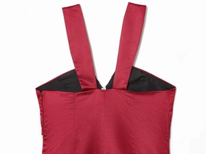 Detailed view of burgundy satin V-neck dress featuring sleek straps and hidden side zipper