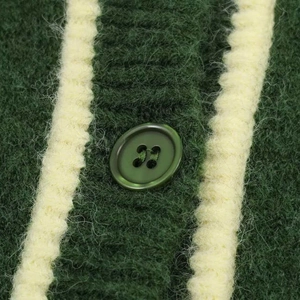Retro dark green knit sweater featuring contrasting cream trim and a matching button detail