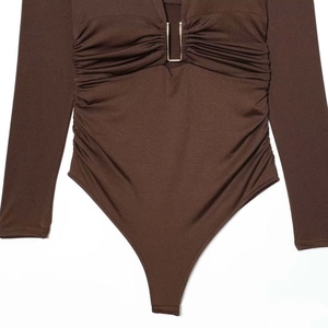 Deep brown long sleeve V-neck bodysuit featuring U-shaped metal buckle and ruched details