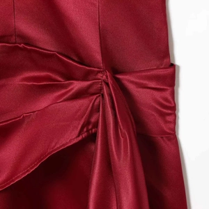 Elegant burgundy satin V-neck dress featuring sophisticated pleated knot front detailing
