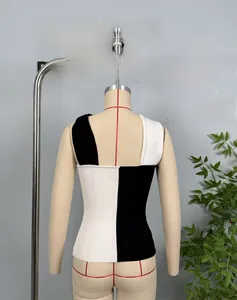 Detailed back view of a slim-fit ribbed knit tank top with black and white color block