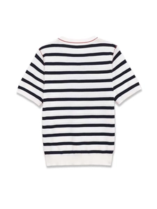 Detail of red contrast stitching on the neckline of a navy and white striped knit top