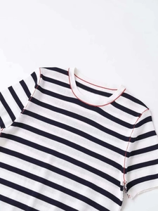 Detail of blue and white striped knit top with red decorative stitching at neckline