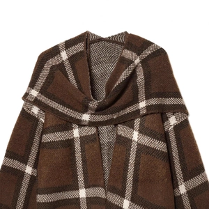 Retro oversized brown and white plaid knit shawl poncho with textured warm fabric