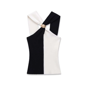 Detail of knit ribbed fabric with contrast paneling and gold hardware buckle