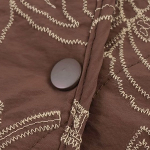 Coffee brown quilted long-sleeve jacket with beige zigzag embroidery and round buttons