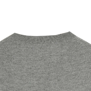 Detail shot of the ribbed round neckline and grey knit texture of this casual sweater