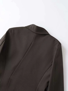 Close-up of the clean stitching and twill fabric texture on the back collar of the blazer