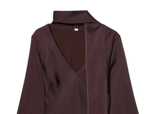 Detailed view of dark brown satin high-neck dress with V-neckline and smooth texture