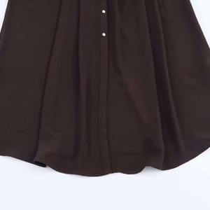 Deep brown pleated midi dress with button-front detail and flowing silhouette