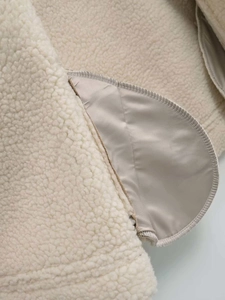 Detail of soft fleece fabric and silky satin lining with premium stitched edges