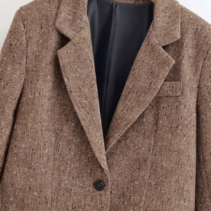 Vintage brown herringbone blazer with classic lapels and single-breasted button closure