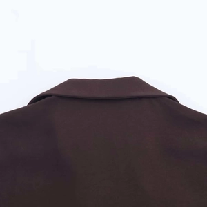 Detailed close-up of the back collar and stitching of a chocolate brown midi shirt dress