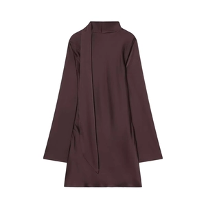 Detail of elegant dark brown satin dress featuring high collar with tie-neck draping