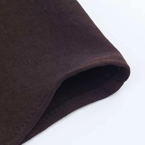 Detailed close-up of premium dark brown fabric texture and high-quality seam stitching
