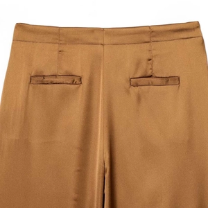 Back view of high-waisted satin wide-leg trousers in bronze with silk-like glossy finish