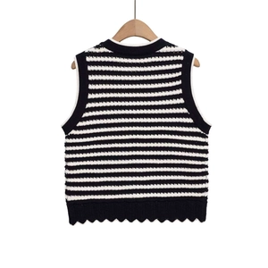 Women's black and white striped knit vest featuring a round neck and scalloped hemline