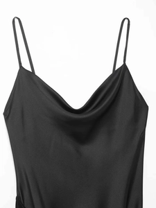 Detail view of the elegant black satin cowl neck design and delicate thin straps on a dress
