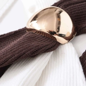 Brown and white knit tank top featuring a luxury rose gold metallic dome button detail