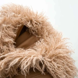 Macro detail of khaki faux fur trim and smooth lining on a winter fashion trench coat