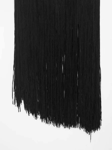 Detailed view of dense black velvet tassels with asymmetric diagonal cut finish