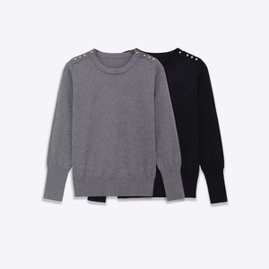 Women's knit sweater with crew neck and golden shoulder buttons in gray and black
