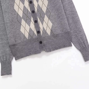 Gray diamond pattern knit cardigan with button closure and ribbed cuffs design