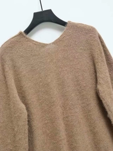 Close-up of soft brown plush knit texture and neckline of this fall fashion sweater