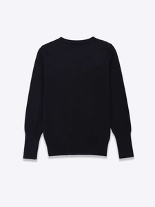 Close-up of ribbed cuffs and hem on a classic black long-sleeved knitted sweater