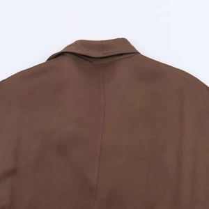 Detail view of the back collar and stitching on the dark brown midi dress with belt