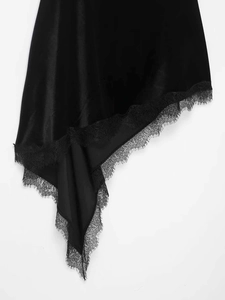 Detail of asymmetrical dress hem featuring elegant black eyelash lace and satin texture