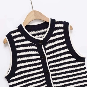 Classic black and white striped knit vest with round neck and three front buttons