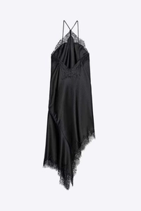 Detail of black satin halter dress showing delicate lace trim and asymmetrical hemline