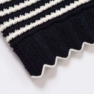 Women's striped knit vest featuring a stylish scalloped hem and premium ribbed texture