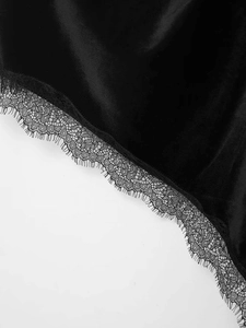 Detailed view of the elegant black velvet fabric with delicate eyelash lace trim