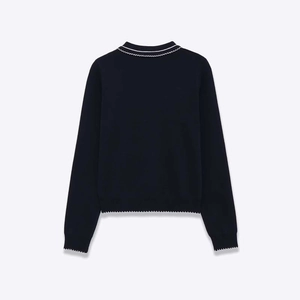 Navy blue long sleeve knit sweater featuring elegant white scallop trim on the back