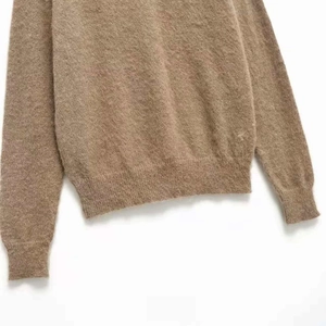 Chic V-neck camel plush knit sweater featuring long sleeves and ribbed cuffs detail