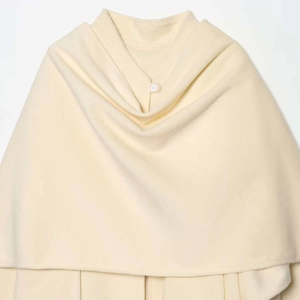 Minimalist cream white fleece cape coat with a single round button closure design